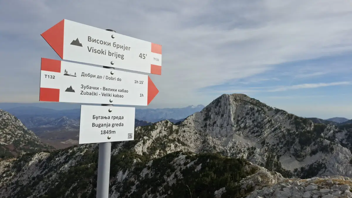 A trail sign in Cyrillic in the Balkan mountains