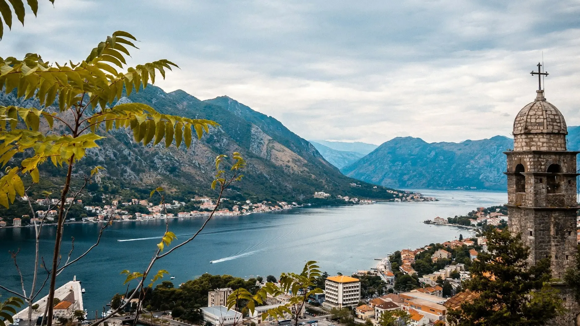 Aerial view of Kotor's medieval Old Town nestled between mountains and the sparkling Adriatic Sea